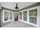 Porch with a fan, white railings, and a view of the trees and sky at 45008 Wigeon Ln # 202, Indian Land, SC 29707