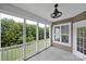 Covered porch with white railings and a view of the green backyard and trees at 45008 Wigeon Ln # 202, Indian Land, SC 29707
