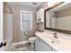 Well-lit bathroom with a vanity, toilet, tub-shower combination, and decorative mirror at 4637 Shannamara Dr, Matthews, NC 28104