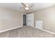 Neutral bedroom with plush carpeting, ample closet space, and a ceiling fan at 4637 Shannamara Dr, Matthews, NC 28104