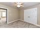 Bedroom showcasing a closet, a window, neutral walls, and comfortable carpeting at 4637 Shannamara Dr, Matthews, NC 28104