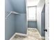 Stylish closet featuring ceramic tile flooring, a shelf, and natural light from a window at 4637 Shannamara Dr, Matthews, NC 28104
