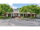 Inviting brick clubhouse with well-manicured landscaping and ample parking, creating a welcoming first impression at 4637 Shannamara Dr, Matthews, NC 28104