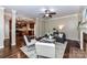 Open concept living room leading to the kitchen, with hardwood floors and stylish furniture at 4637 Shannamara Dr, Matthews, NC 28104
