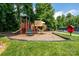 Outdoor playground with swings and slides perfect for recreation, nestled in a green, wooded area at 4637 Shannamara Dr, Matthews, NC 28104