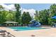 Community pool with a thrilling waterslide and plenty of space for relaxation and fun in the sun at 4637 Shannamara Dr, Matthews, NC 28104