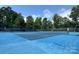 Well-maintained blue tennis court providing a great space for sports and recreation within the community at 4637 Shannamara Dr, Matthews, NC 28104