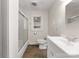 Clean bathroom with shower, toilet, and white vanity, featuring tile flooring at 5170 Woodleaf Rd, Salisbury, NC 28147