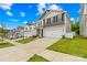 Street view of gray, two-story house with landscaped front yard and wide driveway at 5204 Belstone Ln, Charlotte, NC 28215