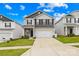 Charming two-story home features a two-car garage, stone accents, and manicured lawn at 5204 Belstone Ln, Charlotte, NC 28215