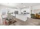 Spacious kitchen with granite island, stainless appliances and adjacent dining area at 5204 Belstone Ln, Charlotte, NC 28215