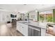 Open concept living space with fireplace flowing into dining area and kitchen at 5204 Belstone Ln, Charlotte, NC 28215