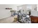 Bright home office space with a large computer, desk and bookshelves at 5204 Belstone Ln, Charlotte, NC 28215