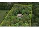 Aerial view of home with property line in wooded area at 550 Burrage Ne Rd, Concord, NC 28025