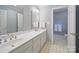 Bathroom with double vanity, mirrors, and tiled flooring at 550 Burrage Ne Rd, Concord, NC 28025