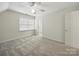 Bedroom with neutral carpet and ceiling fan at 550 Burrage Ne Rd, Concord, NC 28025