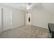 Spacious bedroom featuring neutral carpet and white doors at 550 Burrage Ne Rd, Concord, NC 28025