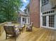 Wooden deck with outdoor seating with direct access to the screened-in porch and overlooking a private backyard at 550 Burrage Ne Rd, Concord, NC 28025