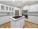Spacious kitchen features stainless steel appliances and cooktop island at 550 Burrage Ne Rd, Concord, NC 28025