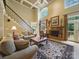 Bright living room with fireplace, staircase, coffered ceiling and hardwood floors at 550 Burrage Ne Rd, Concord, NC 28025