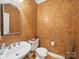 This powder room features striking faux painted walls and a modern mirror above a white sink at 550 Burrage Ne Rd, Concord, NC 28025