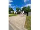Charming single-story home featuring a large driveway and well-maintained landscaping, perfect for suburban living at 6000 Amberly Ln, Charlotte, NC 28213
