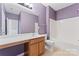 Bright bathroom with a combo tub and shower, vanity, and toilet at 6309 Margaret Ct, Indian Trail, NC 28079