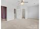 Bright bedroom with an ornate chandelier, multiple doorways and neutral carpeting at 6309 Margaret Ct, Indian Trail, NC 28079