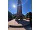 Historic clock tower surrounded by brick walkways and benches, a picturesque community landmark at 6309 Margaret Ct, Indian Trail, NC 28079