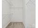 This walk-in closet has metal shelving around the perimeter for lots of storage at 6309 Margaret Ct, Indian Trail, NC 28079