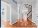 Open entryway with hardwood floors, stairs, and views of living areas, offering great flow at 6309 Margaret Ct, Indian Trail, NC 28079