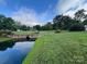 Scenic green space features a pond with a bridge at 6309 Margaret Ct, Indian Trail, NC 28079