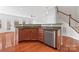 Bright kitchen featuring granite countertops, stainless steel appliances, and hardwood floors at 6309 Margaret Ct, Indian Trail, NC 28079