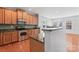 Spacious kitchen with wooden cabinets, stainless steel appliances, and granite countertops at 6309 Margaret Ct, Indian Trail, NC 28079