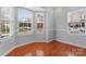 Bright living space with large windows, hardwood floors, and neutral paint, great for entertaining at 6309 Margaret Ct, Indian Trail, NC 28079
