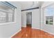 Sunlit living room with hardwood floors and large windows overlooking the neighborhood at 6309 Margaret Ct, Indian Trail, NC 28079