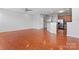 Open living space with hardwood floors and access to kitchen area at 6309 Margaret Ct, Indian Trail, NC 28079
