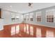 Bright living room featuring hardwood floors, large windows, and natural light at 6309 Margaret Ct, Indian Trail, NC 28079
