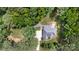 Lush trees surround this home with an expansive lawn and patio area in this high definition aerial view at 6419 Antioch Ct, Matthews, NC 28104