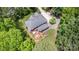 Aerial view of a home with a backyard deck and garden surrounded by mature trees and manicured lawns at 6419 Antioch Ct, Matthews, NC 28104