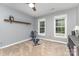 Spare bedroom with neutral gray walls, carpet, and two large windows letting in plenty of natural light at 6419 Antioch Ct, Matthews, NC 28104