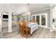 Inviting dining room featuring wood floors, table with seating for four, and natural light at 6419 Antioch Ct, Matthews, NC 28104