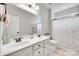 Bright bathroom features a double sink vanity, framed mirror, and a shower-tub combo at 645 Brookhaven Dr, Fort Mill, SC 29708