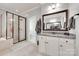 Modern bathroom featuring a glass-enclosed shower, granite counters, and ample vanity storage at 645 Brookhaven Dr, Fort Mill, SC 29708