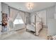 Charming bedroom with a canopy bed, dresser, and soft lighting creates a cozy atmosphere at 645 Brookhaven Dr, Fort Mill, SC 29708
