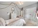 Well-lit bedroom features a stylish canopy bed, dresser, and carpeted flooring at 645 Brookhaven Dr, Fort Mill, SC 29708
