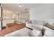 Spacious upstairs bonus room with hardwood floors, a comfortable sofa, and a wooden staircase at 645 Brookhaven Dr, Fort Mill, SC 29708