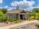 Clubhouse exterior featuring stone accents, manicured landscaping, and well-maintained sidewalk at 645 Brookhaven Dr, Fort Mill, SC 29708
