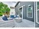 View of the deck with gray composite decking and outdoor seating with blue cushions at 645 Brookhaven Dr, Fort Mill, SC 29708