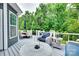 Enjoy outdoor living on the deck with patio set, blue seating, and wooded views at 645 Brookhaven Dr, Fort Mill, SC 29708